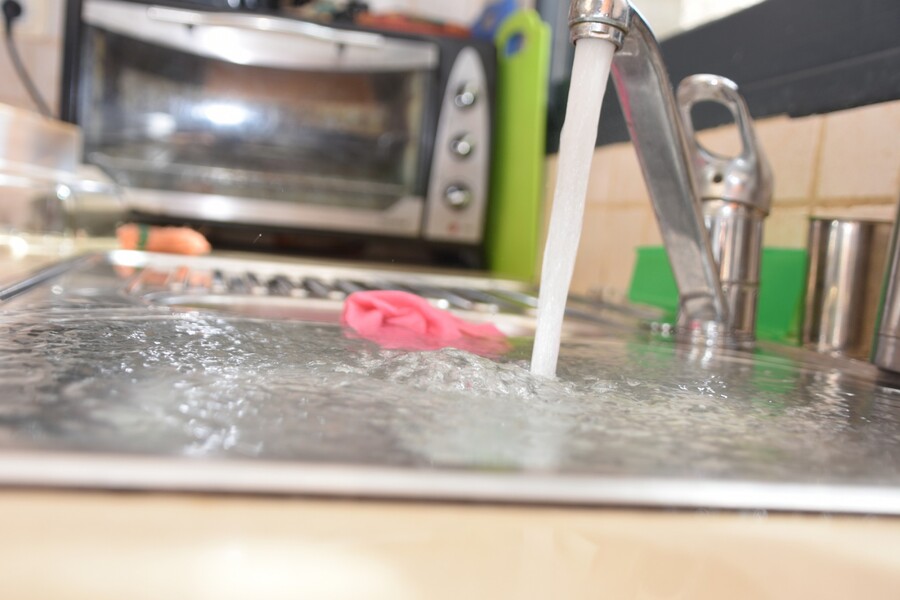 Sink overflowing due to clogged drain ... call Plumbing Warehouse for drain cleaning.